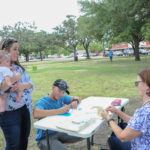 KBAD members register voters at the Kyle/Buda-Area Democrats Ice Cream Social on Aug. 5 at the Kyle City Square Park gazebo. 
Photo by Christopher Paul Cardoza