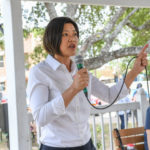 Kathy Cheng (candidate for Justice, Texas Supreme Court, Place 6) speaks at the Kyle/Buda-Area Democrats Ice Cream Social on Aug. 5 at the Kyle City Square Park gazebo. 
Photo by Christopher Paul Cardoza 